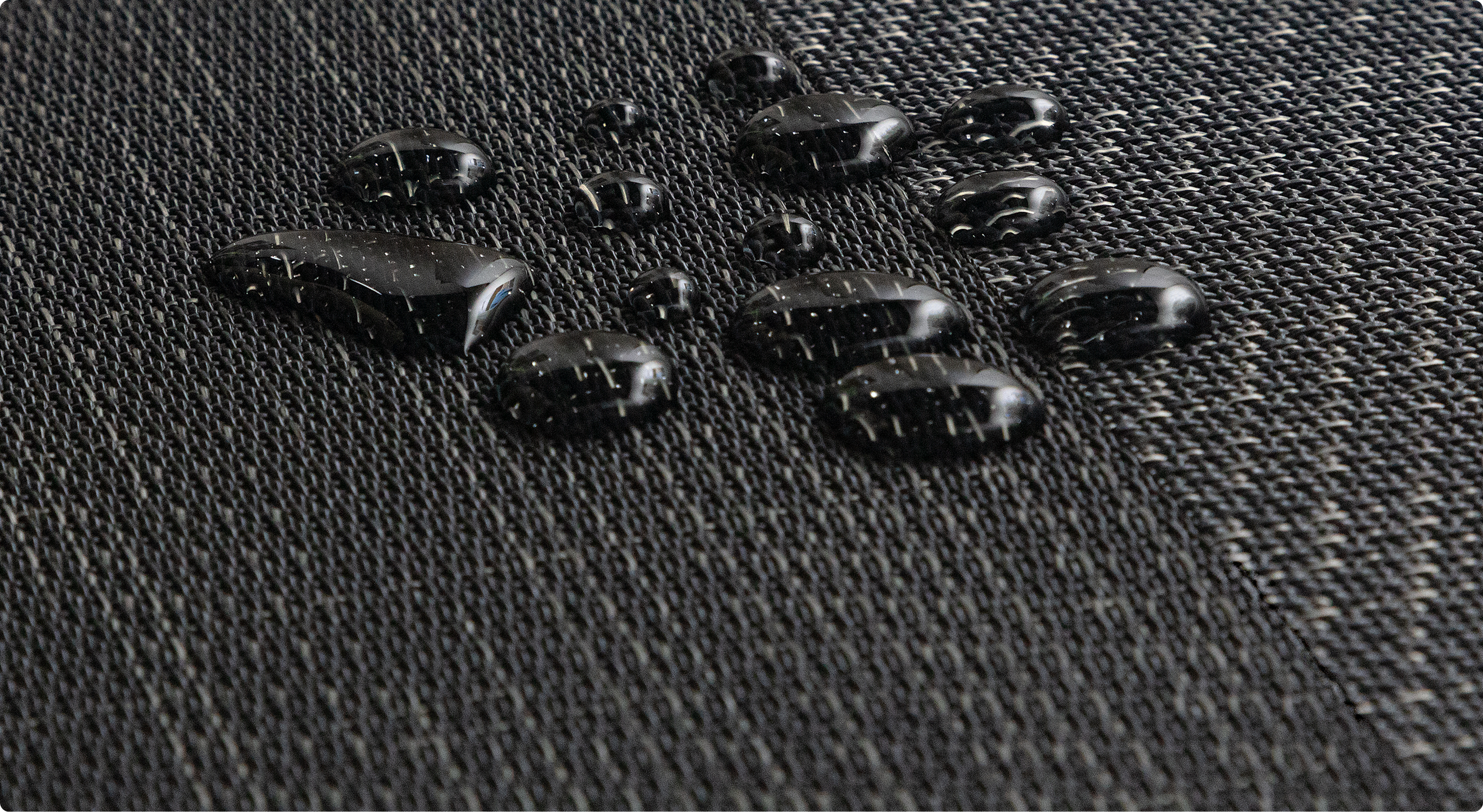 Water beading on the surface of AXON woven vinyl flooring