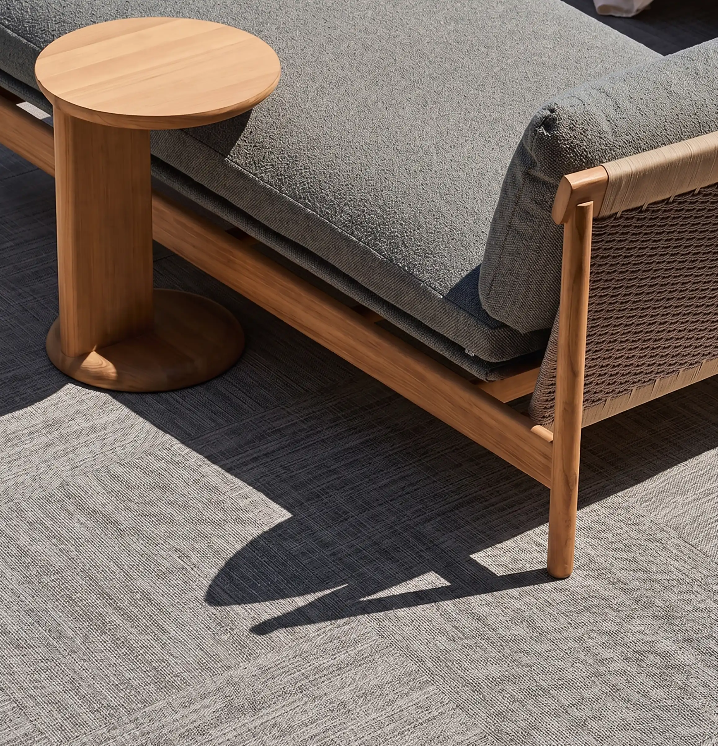 AXON woven flooring on an outdoor lounge terrace
