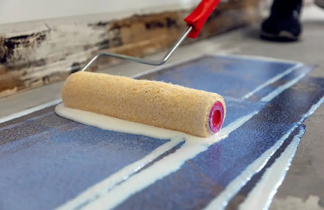 Rolling Traction subfloor grip coating onto a prepared subfloor